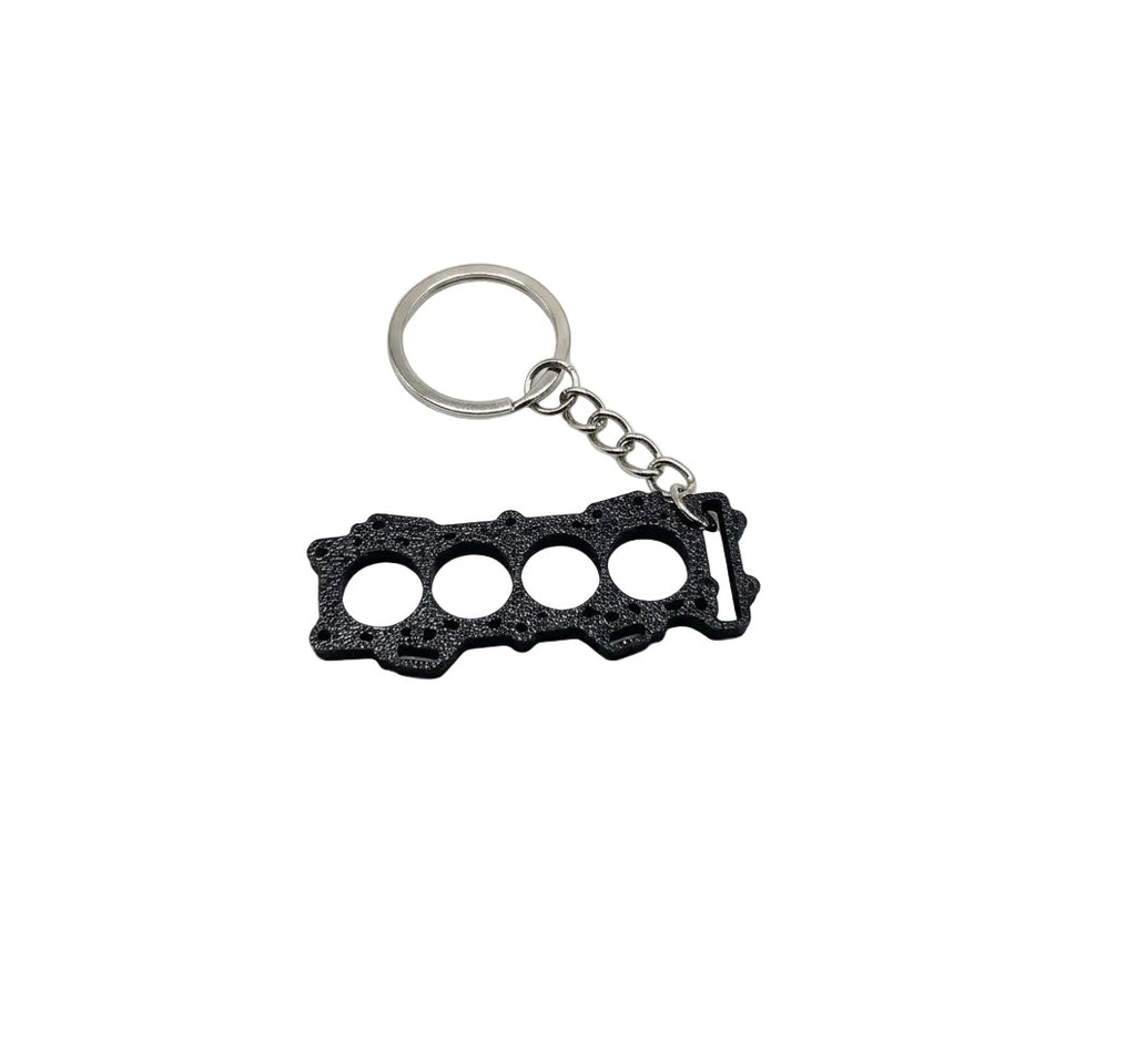 Porte-clé pour Kawasaki ZX6R, sur modèle de joint de culasse de Kawasaki ZX6R
Fabriqué en France
Impression 3D